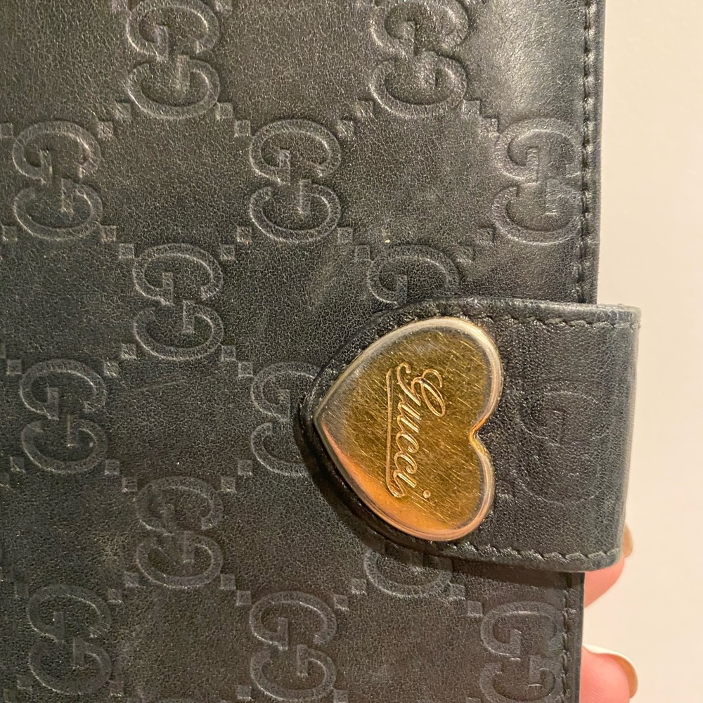 Gucci black leather heart wallet.